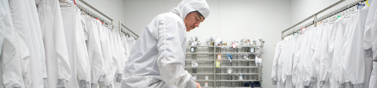 CNF staff member gowns up to enter the cleanroom