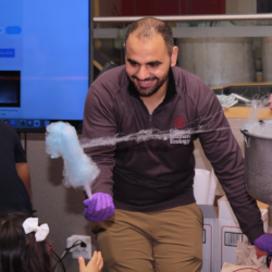 A researcher uses cotton candy fibers to demonstrate electrospinning